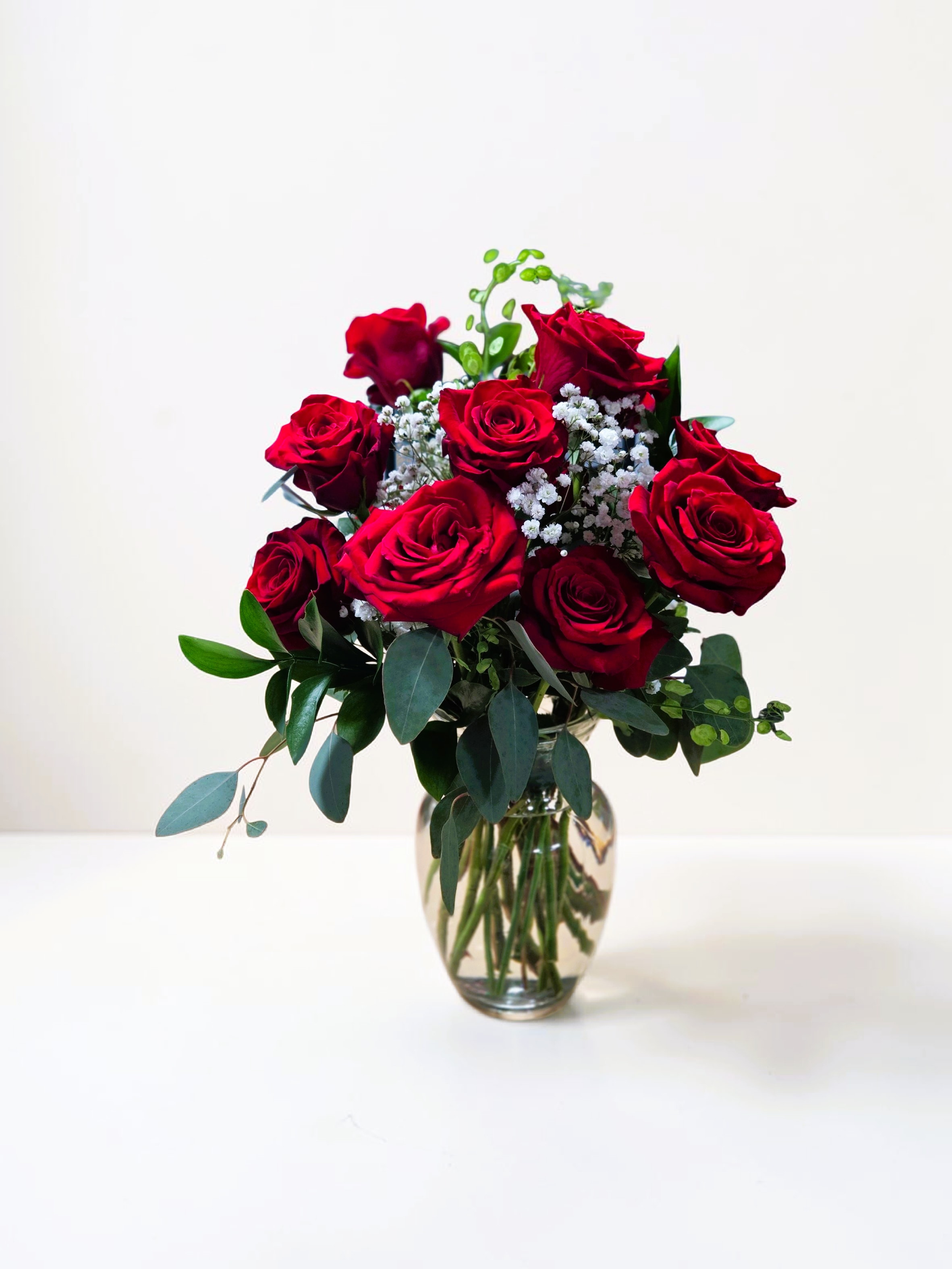1 Dozen Red Roses - One dozen red roses with baby's breath... classic! Perfect romantic gift for Valentine's Day, I love you, or an Anniversary.   APPROXIMATE DIMENSIONS: 25" H X 18" W