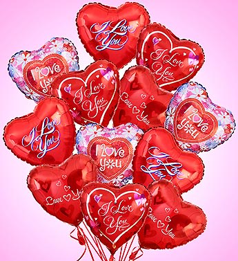 Bouquet of red heart-shaped 'I Love You' foil balloons on a pink background