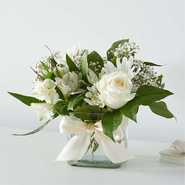Graceful Bouquet by FTD - GRACEFUL BOUQUET These elegant bright blooms are designed to celebrate the beauty of life.  Please Note: The bouquet pictured reflects our original design for this product. While we always try to follow the color palette, we may replace stems to deliver the freshest bouquet possible, and we may sometimes need to use a different vase. DETAILS The Standard Bouquet is approximately 9"H x 9"W. Designed by florists, ready to display. For long–lasting blooms, replace the water daily. We suggest trimming the stems every couple days. Pet Safety Precautions: This bouquet or plant may include flowers and foliage that are known to be toxic to pets. To keep them safe, be sure to keep this arrangement out of your pet's reach. BLOOM DETAILS Alstroemeria/Peruvian Lily 
