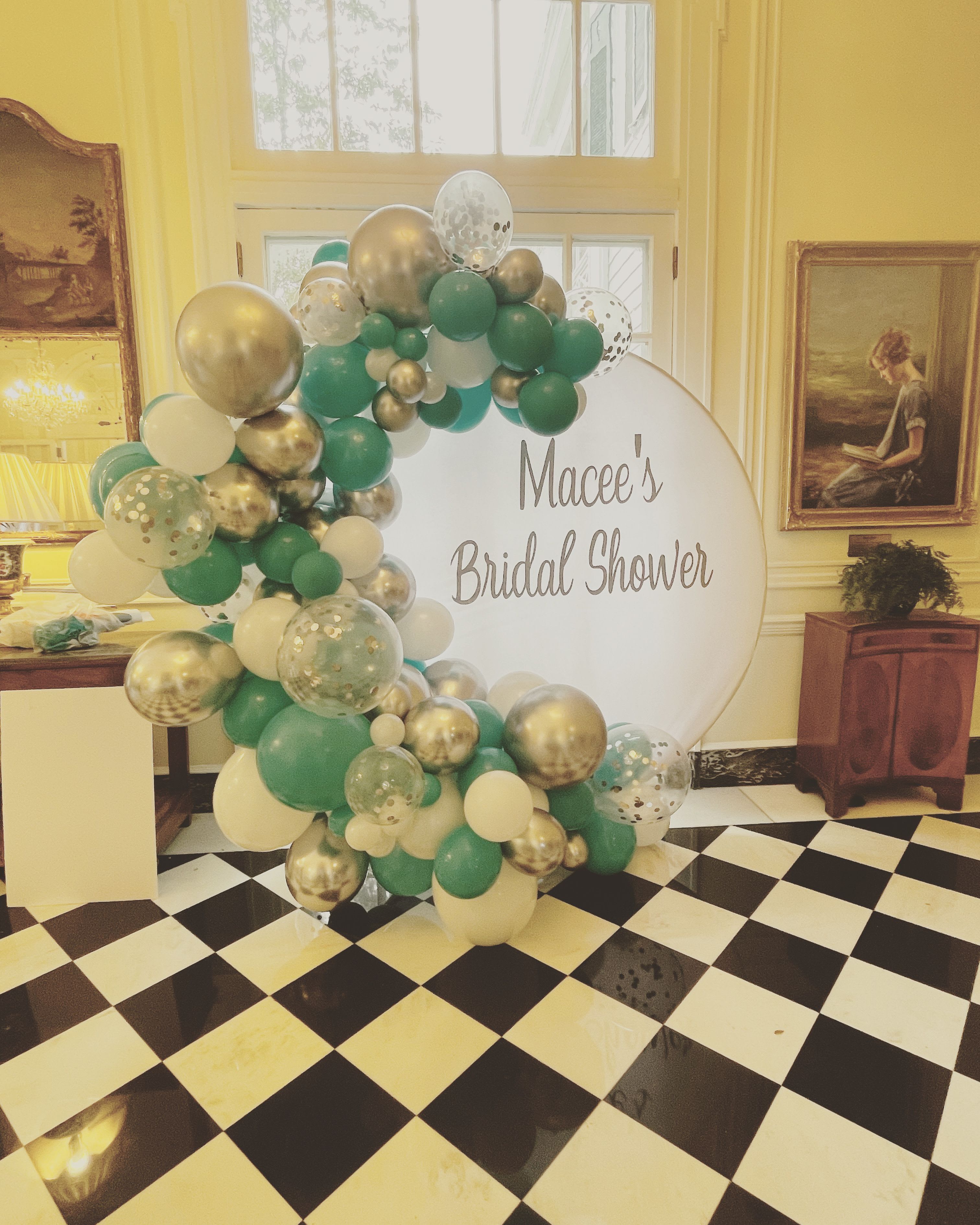 Balloon arch beside a sign reading "Macee's Bridal Shower"