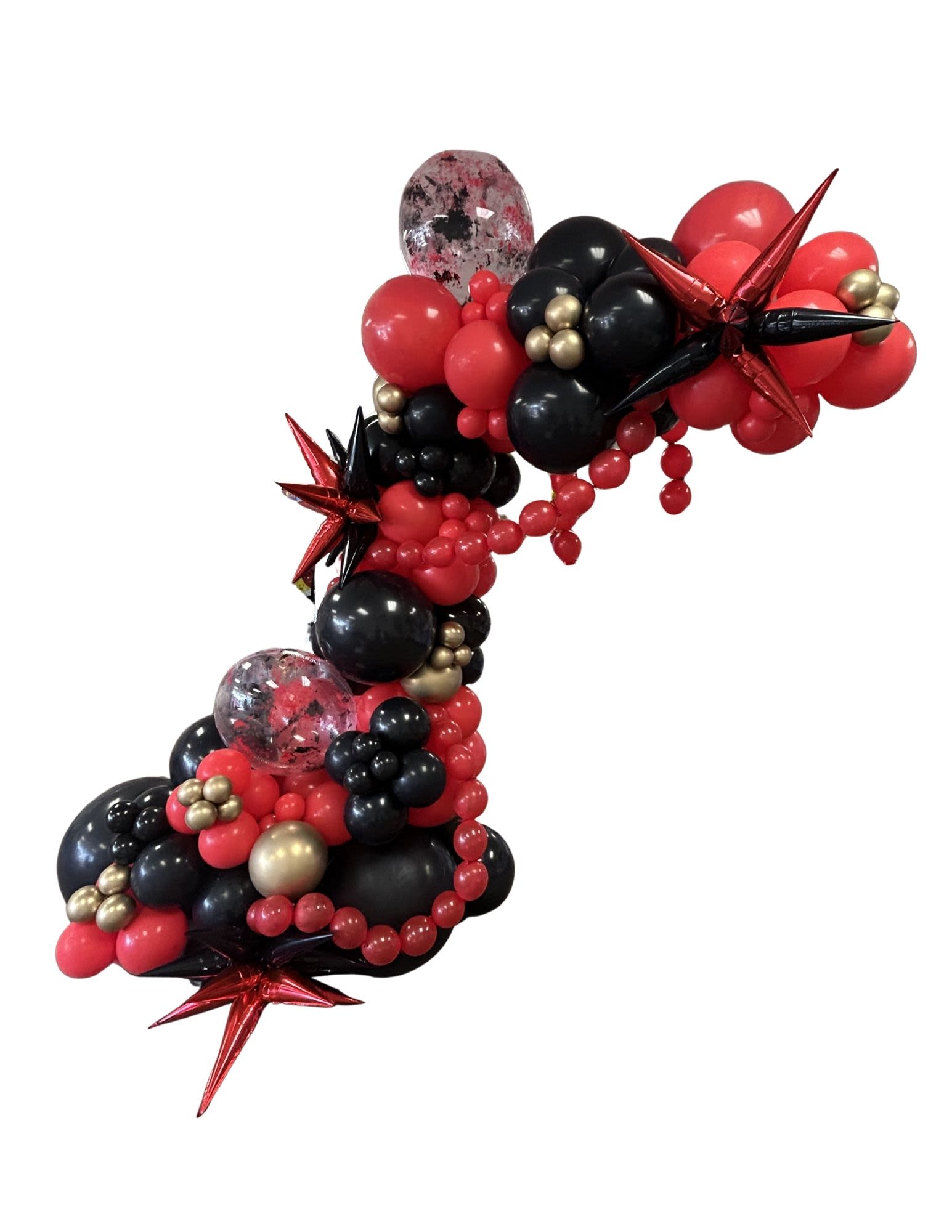 Red, black, and gold balloon arch with star balloons