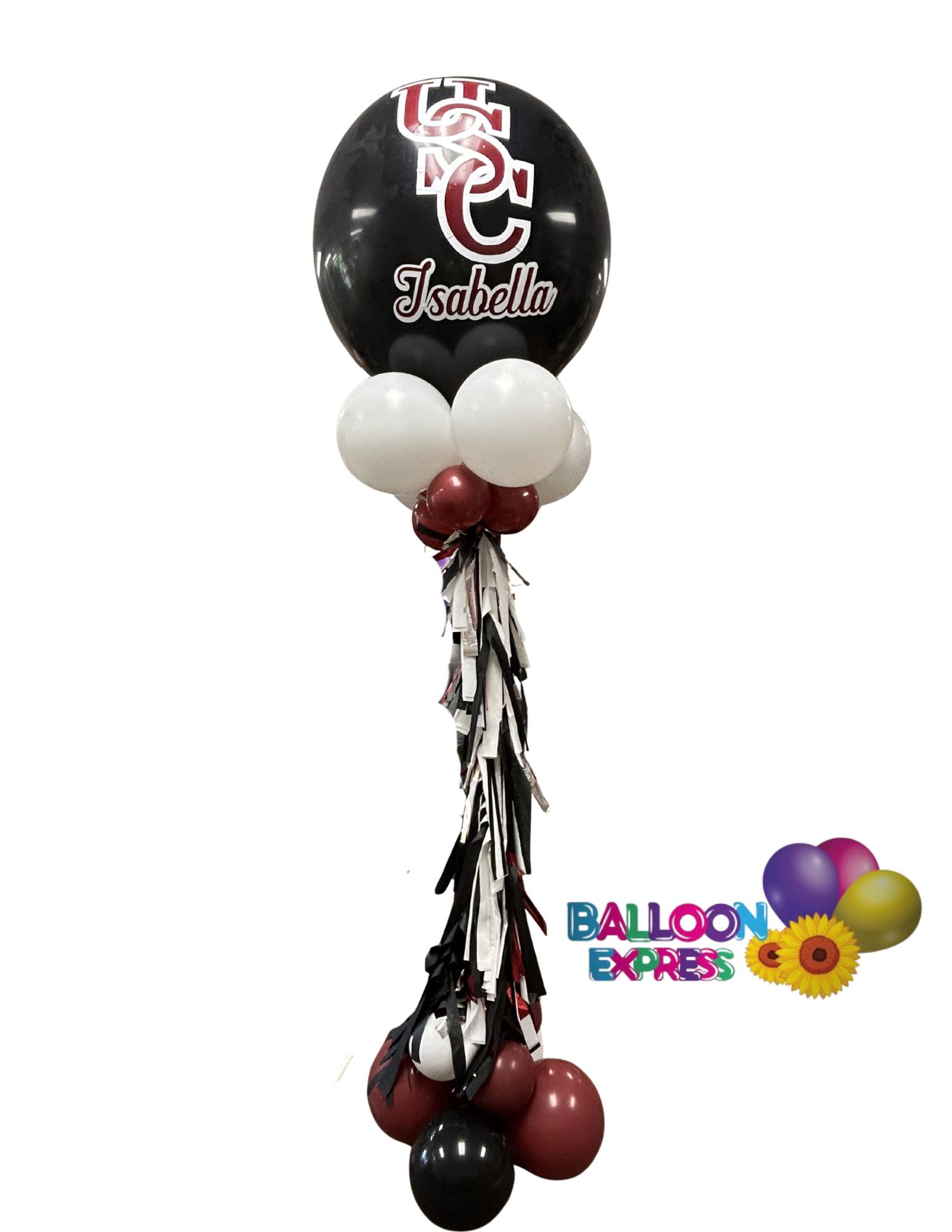 Fabulous Grad Column  - Make graduation day feel official and unforgettable with a tall graduation column built around a large personalized  balloon-perfect as a graduation party centerpiece or a photo backdrop for the graduate. This graduation decoration reads as a celebratory, school-spirited piece: the printed name decal and school-style logo on the focal balloon put the graduate front and center!   The column features clustered smaller balloons in that can be customized to any color, gathered around the central personalized globe and base for visual weight, with long  tassels cascading down the middle to add movement and texture. Hard goods include the printed name decal and coordinated balloon tassels; the tower stands tall enough to anchor an entryway, stage, or reception table and photographs beautifully when paired with caps, gowns, or school decor.  This is the kind of display that makes the grad feel truly celebrated-great for congratulating a student, marking commencement, or creating a memorable photo moment. Order with the graduate's name for personalization; light indoor use will keep balloons looking their best through the party.