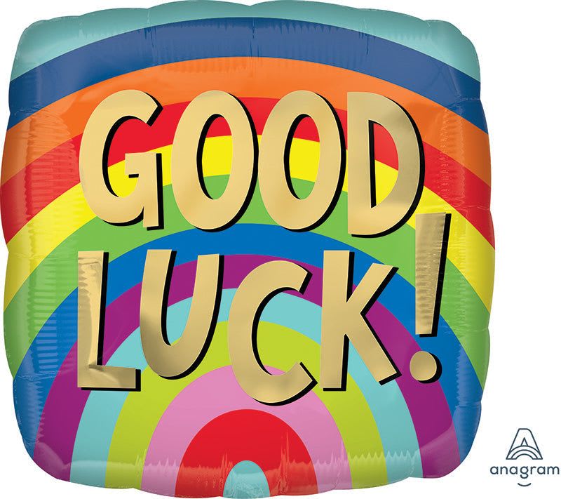 18" Good Luck Mylar - A bright, playful 18" Good Luck Mylar balloon makes a cheerful congratulations gift for graduations, new jobs, moving-day celebrations, or anyone who could use a little extra luck. The square foil balloon reads GOOD LUCK! in large gold letters across a vivid rainbow arc-saturated bands of red, orange, yellow, green, blue, purple, and pink create an instantly celebratory look that will make the person you're thinking of smile.  This mixed-color balloon comes in lively yellow, blue, and pink tones and includes a durable foil finish for a long-lasting shine. The bold graphics and gold lettering stand out on their own or pair easily with a small bouquet or gift basket to create a personalized congratulations package. At 18 inches, it's the right size to float above a table centerpiece or be tied to a bouquet-perfect for sending encouragement, celebrating milestones, or saying "good luck" with a bright, confident flourish.