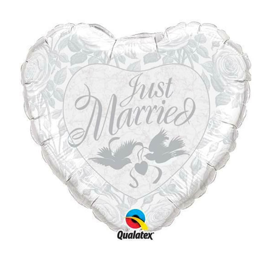 18" Just Married Mylar - A soft white heart-shaped foil balloon that says "Just Married" in elegant gray script-perfect for a wedding gift or to celebrate newlyweds. This 18" Just Married Mylar arrangement reads as a romantic accent for a wedding reception, bridal shower, anniversary celebration, or to congratulate the couple the moment they return home.  The balloon is predominantly white with pale gray lettering and delicate floral patterning around the edges, plus two peaceful dove graphics near the base for an extra touch of symbolism. Made from durable foil (Qualatex), it holds helium well and pairs beautifully with white roses, greenery, or a simple bouquet if you want a fuller presentation. Order for same-day delivery in many areas and note that foil balloons should be kept away from sharp objects and heat to maintain their look through the celebration.