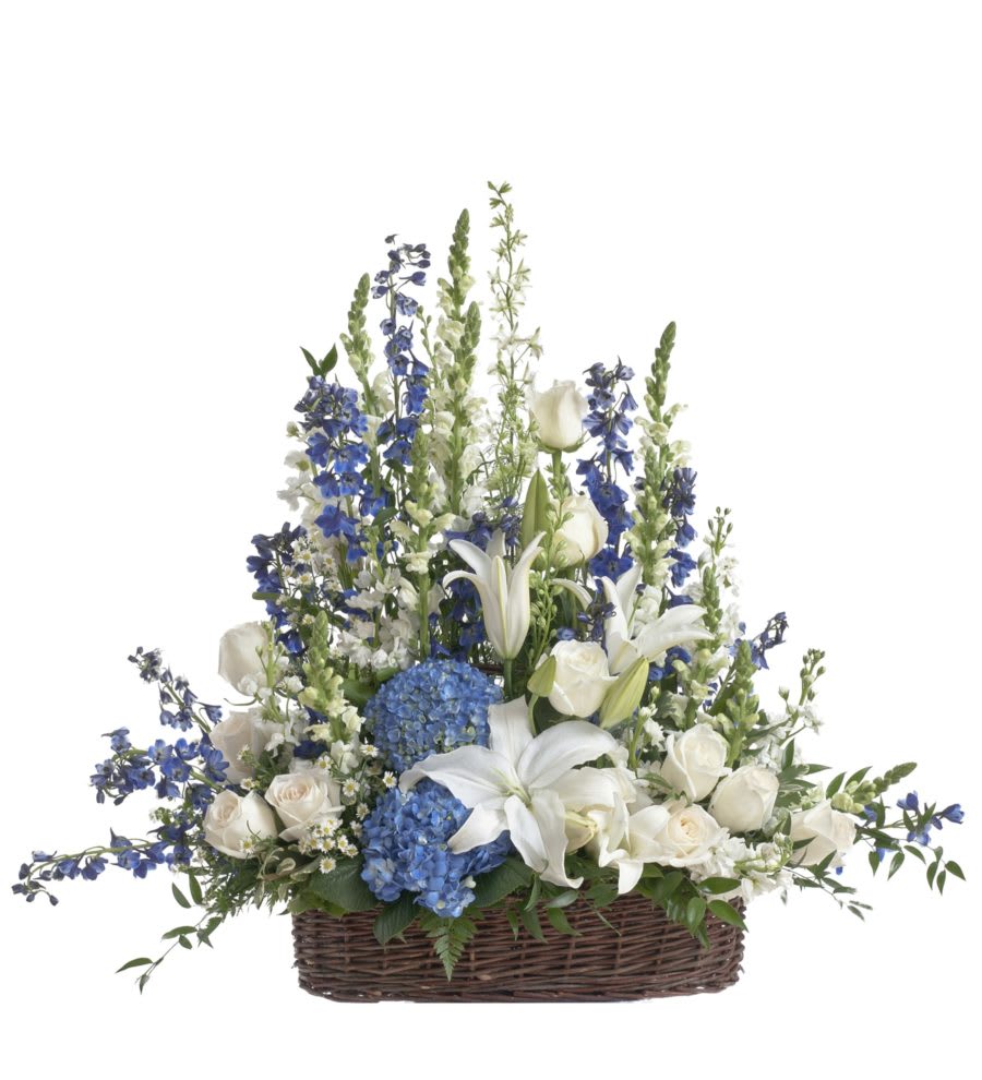 Peaceful White &amp;  Blue sympathy Basket  - Large blue and white basket filled with blue delphinium, white lilies, white roses, larkspur, and snapdragons is a beautiful sympathy tribute.