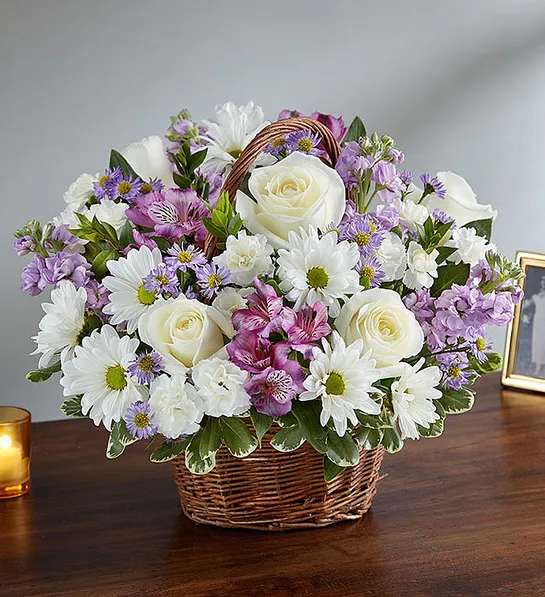 Peace, Prayers &amp; Blessings Lavender &amp; White - Just as lavender is said to hold a sacred place in nature, the departed will always hold a sacred place in your heart. Our lavender and white arrangement, artistically designed inside a keepsake willow basket, is a touching way to convey your love and sincerest blessings.