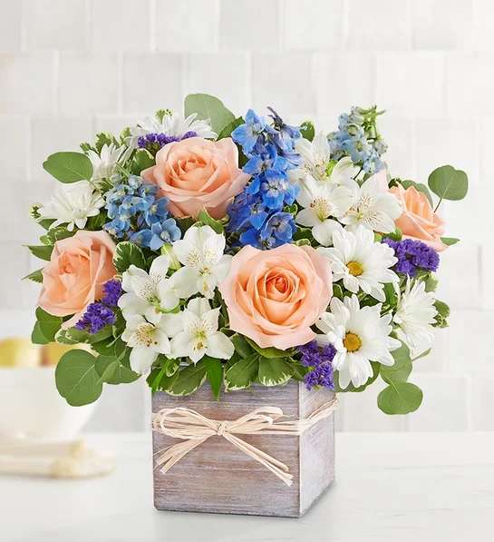 Coastal Breeze - EXCLUSIVE Inspired by the soothing shades of a seaside retreat, our popular bouquet will bring its tranquil beauty to someone special