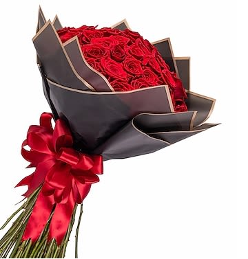 Bouquet of red roses wrapped in dark paper with a red ribbon