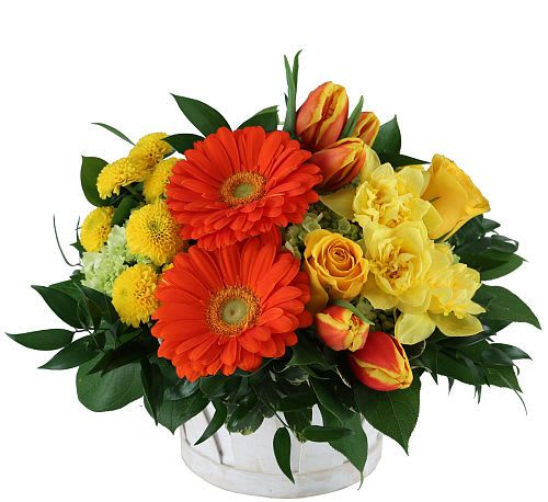 Orange gerberas and yellow roses in a white vase