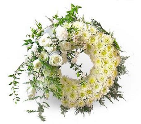 Heart-shaped floral wreath with white and pale yellow flowers