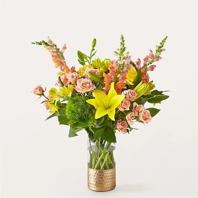 Getaway Bouquet - Take a trip to somewhere warm with this sunny bouquet, bursting with peach spray roses, orange snapdragon, and yellow lilies.