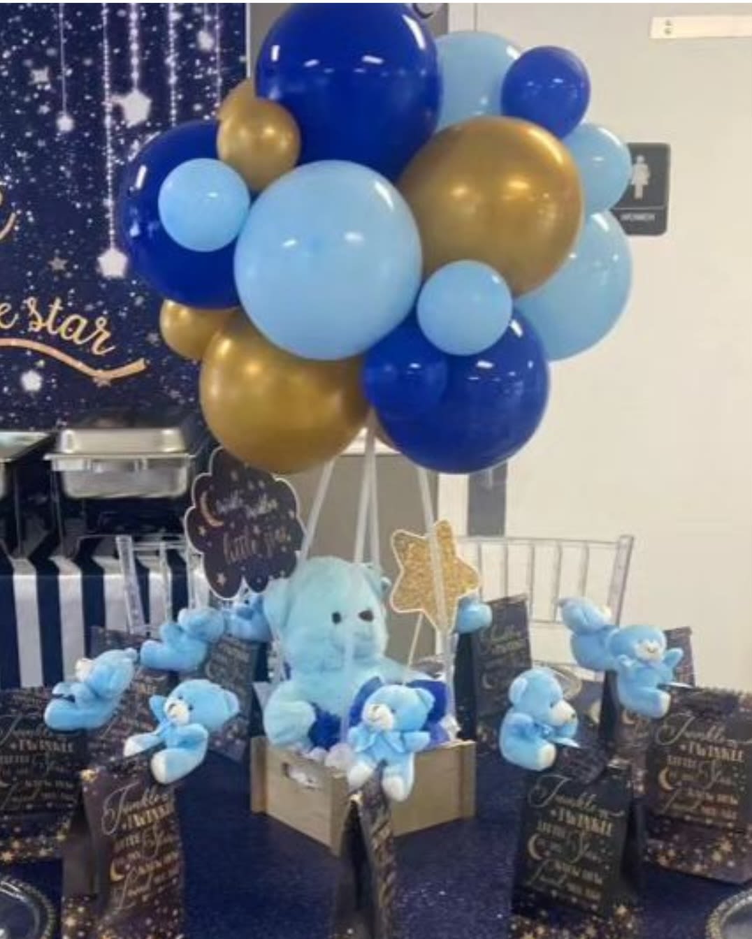 Blue and gold balloon cluster with teddy bears and gift boxes