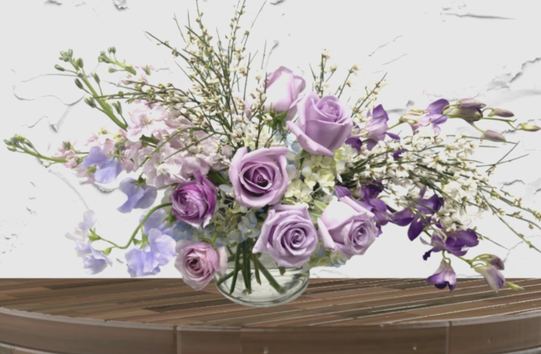 Master Florist's Signature Collection - "Hand-crafted by accredited Master Florist Tricia Won (AIFD, EMC, IMF) No two arrangements are identical." Our Signature Collection is a bespoke service, offering a weekly rotation of the world’s most exquisite blooms. We pair the highest-quality imports with upscale, curated vessels—from heavy-weighted ceramics to architectural glass—ensuring your arrangement is a complete piece of home decor from top to bottom.  The Aesthetic: A Weekly Masterpiece Our look is defined by lush, romantic abundance. Every week, we curate a new "Flower Menu" based on the finest seasonal arrivals. Depending on the week's harvest, your arrangement will feature either:  Vibrant &amp; Bold: A rich, high-contrast palette of deep jewel tones and striking focal flowers.  Soft &amp; Romantic: A dreamy, ethereal collection of delicate pastels and airy textures.  Select Your Tier of Luxury We offer our signature romantic style at three distinct price points to suit every space:  The Standard: An intimate, high-impact arrangement styled in a premium small-scale vessel. Ideal for a bedside table or elegant desk.  The Deluxe: Our signature size. A lush, medium-scale centerpiece featuring a high density of premium blooms and garden accents in a statement vase.  The Premium: The ultimate expression of luxury. A large-scale, 360-degree masterpiece designed to anchor a room, featuring our rarest imports and a substantial heirloom vessel.