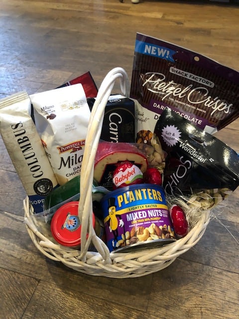 Basket of assorted snack packages and candy