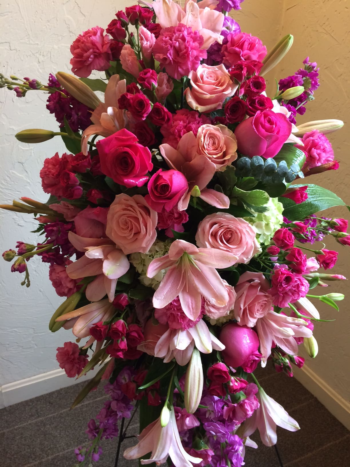 Large bouquet of pink roses, lilies, and carnations