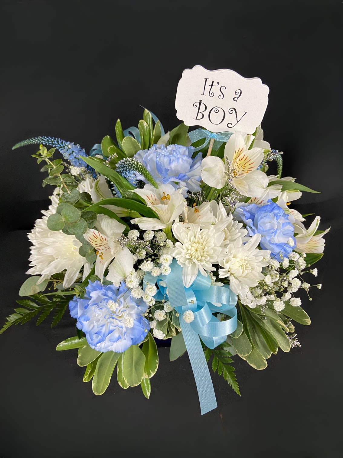 Sweet Baby Blue - Welcome a new bright-eyed baby boy into the world with this blue cube of alstroemeria, carnations, and other seasonal flowers.