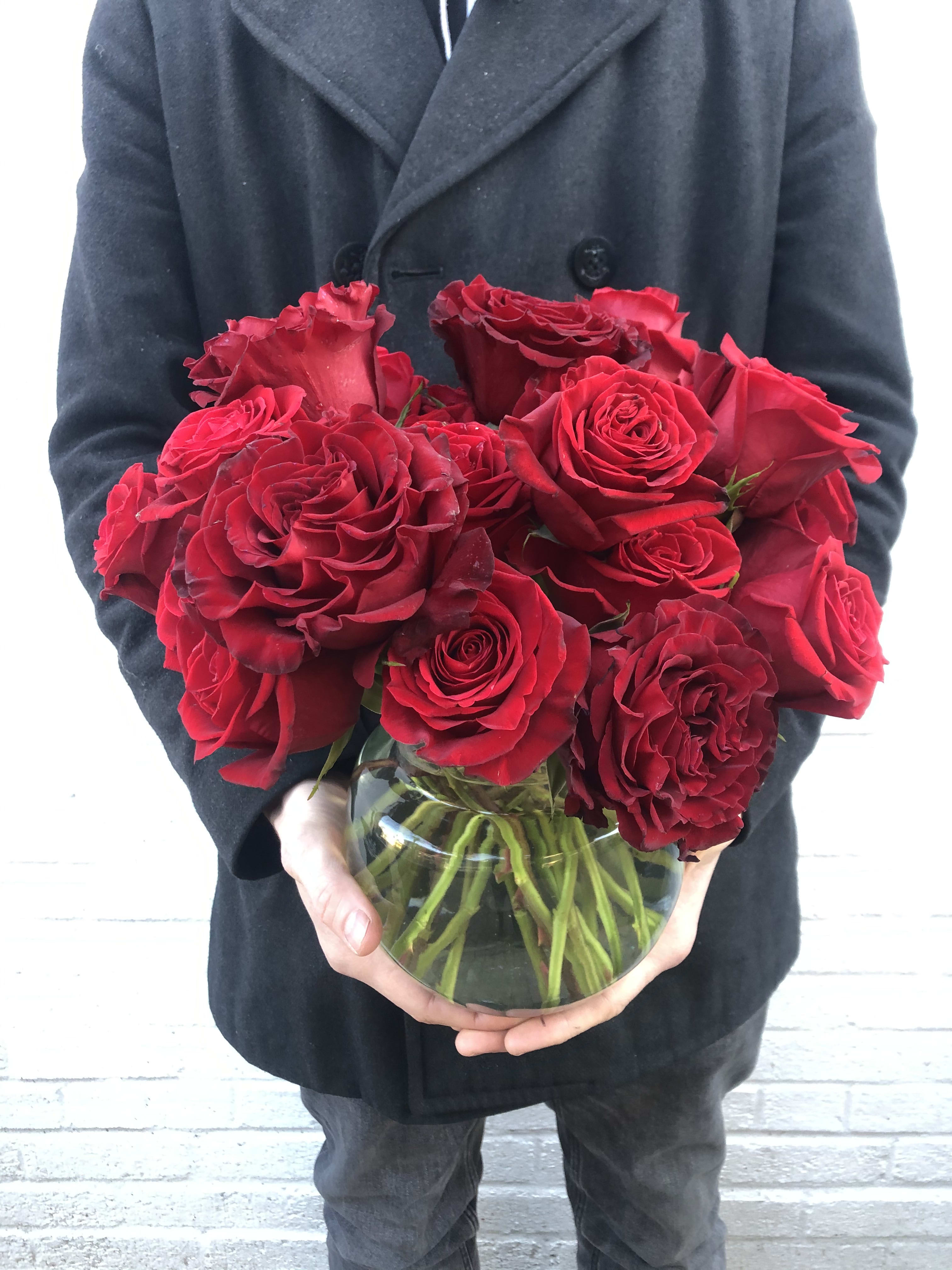 Bouquet of red roses in a clear glass vase