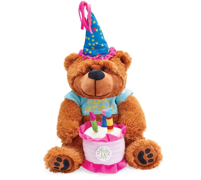 Birthday teddy bear plush with party hat holding a pink cake with candles