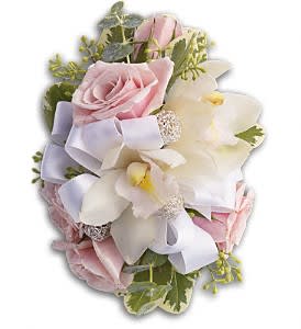Bouquet of pink roses and white orchids with a lavender ribbon