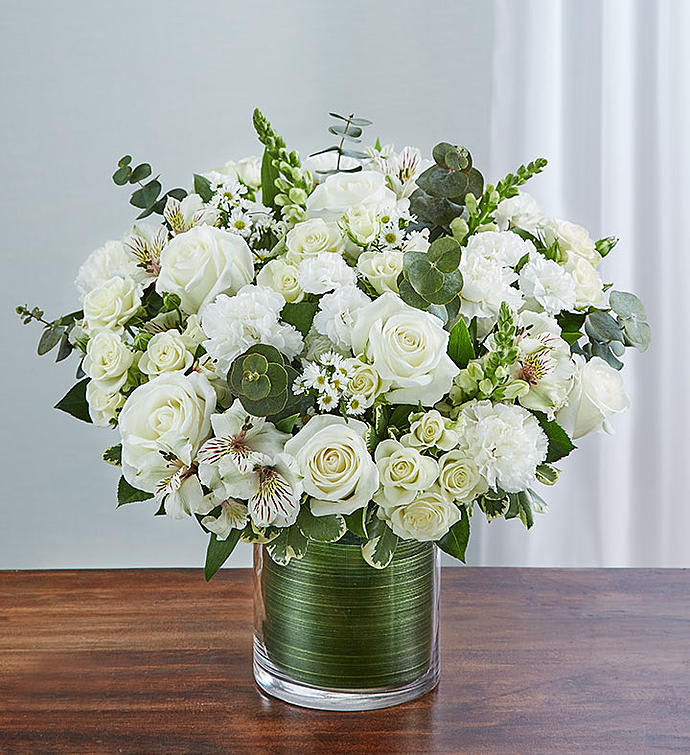 White rose bouquet in a clear glass vase