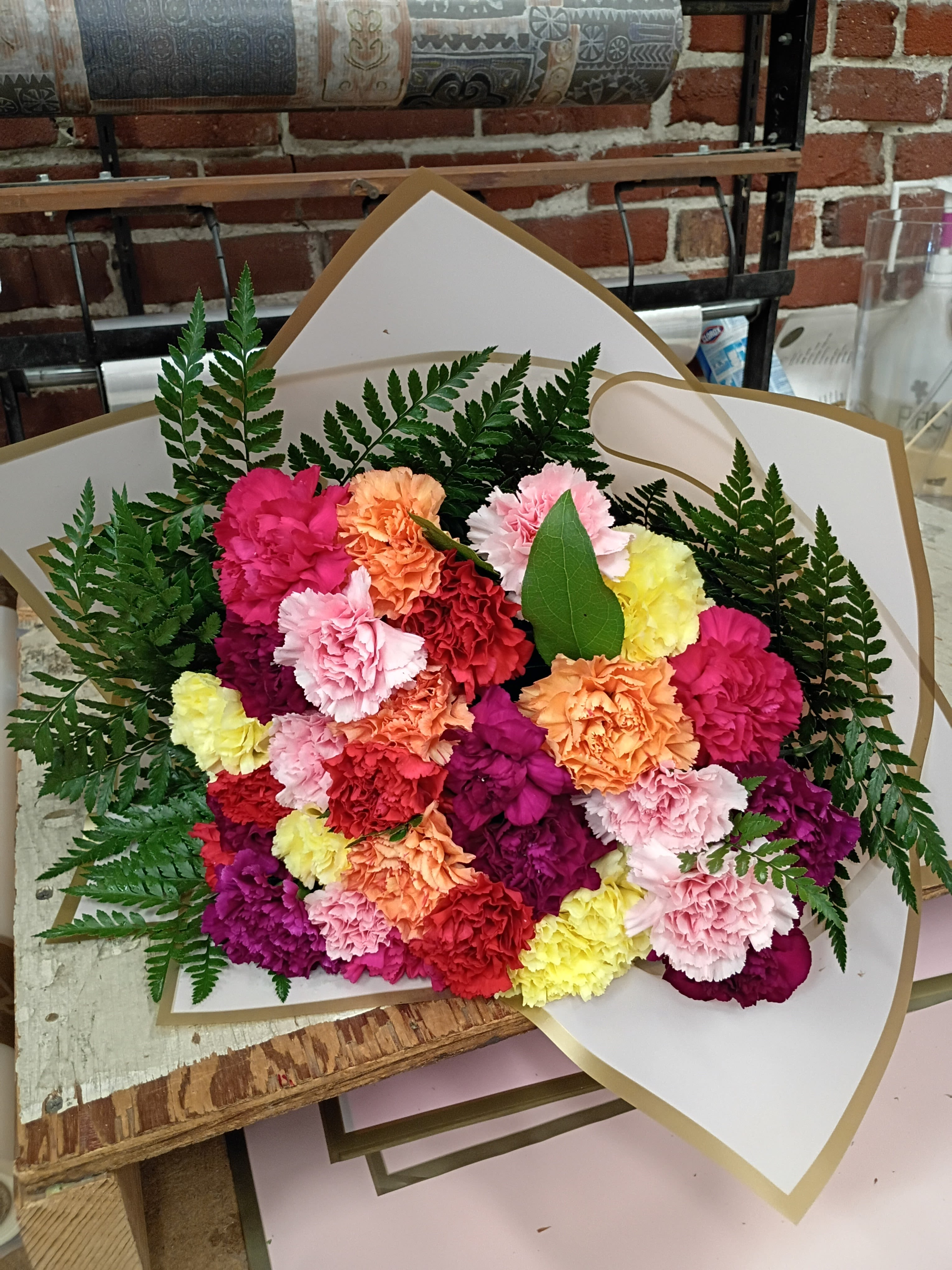 Beautiful Carnation Bouquet - Bouquet colors may vary due to availability of carnations.  Bouquet consists of 25 carnations and greenery wrapped in decorative paper tied up with colorful curling ribbon.