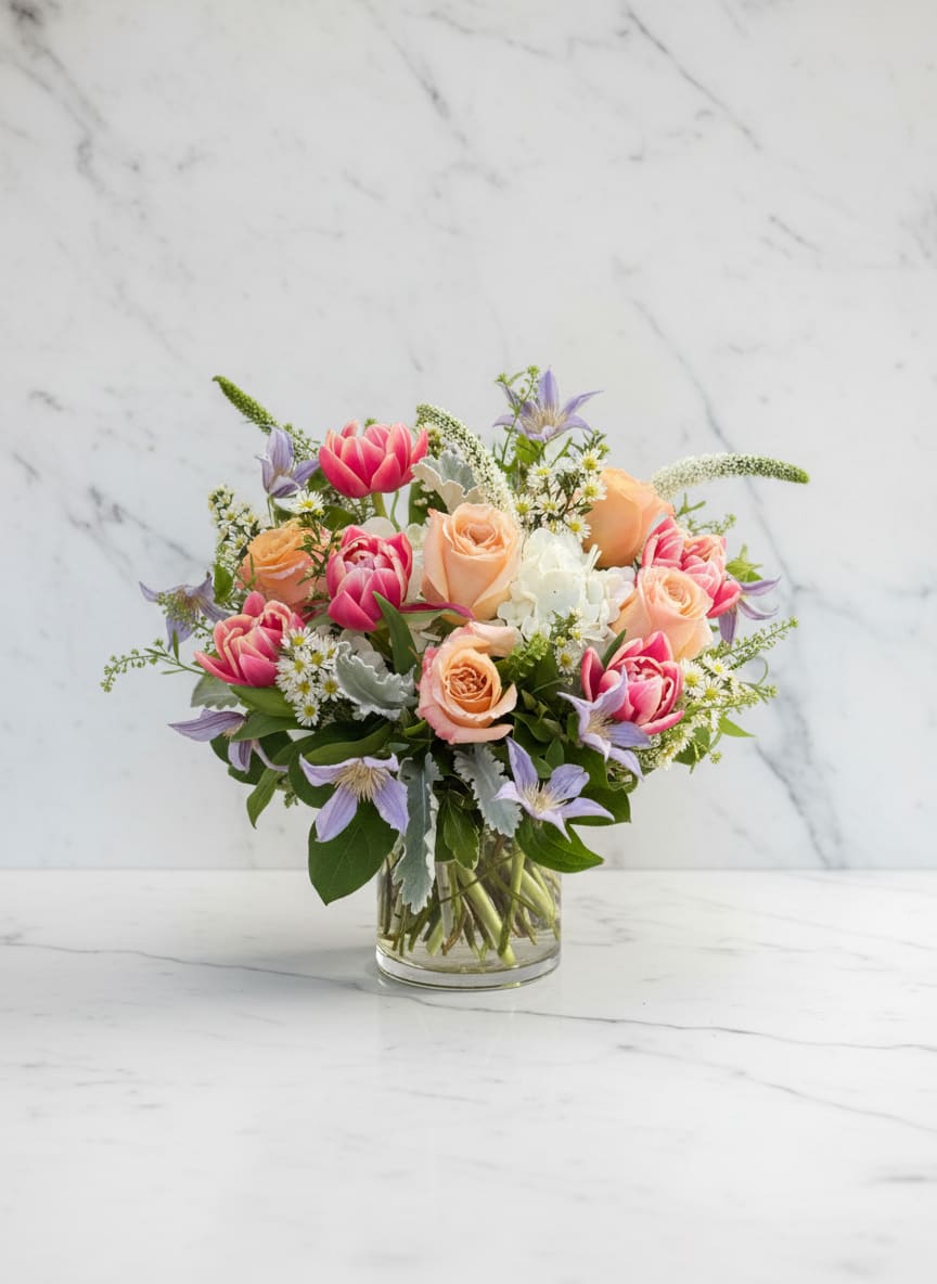 Pastel Whimsy - Delicate, dreamy, and full of charm — Pastel Whimsey captures the sweet side of spring. This airy arrangement features soft blush, peach, lavender, and cream blooms, artfully gathered with seasonal greenery for a light and elegant look.  Perfect for birthdays, thank-yous, or simply brightening someone’s day, this arrangement brings a touch of floral magic to any space.  Each bouquet is handcrafted at Polk Street Florist using the freshest seasonal flowers. Colors and flower varieties 