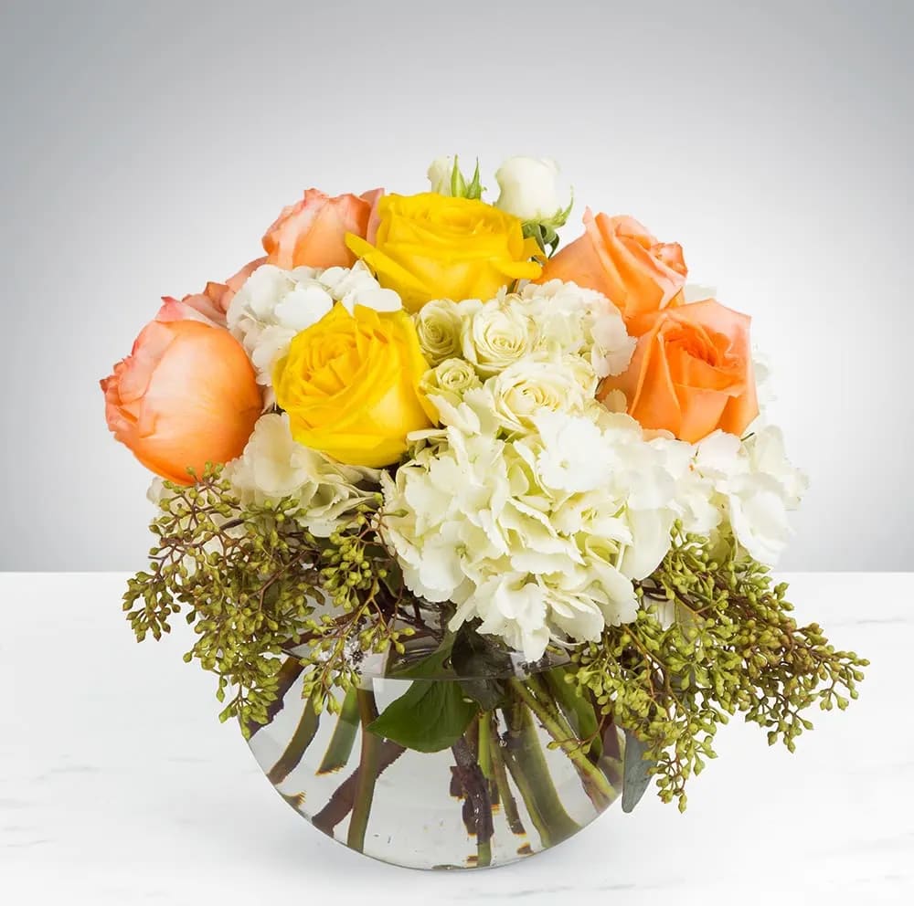 Cheery Moments by BloomNation™ - Brighten someone's day with this cheerful bouquet. This arrangement includes roses and hydrangea and is the perfect gift for a birthday, to celebrate new beginnings, or to cheer someone up. APPROXIMATE DIMENSIONS: 10" D X 11" H