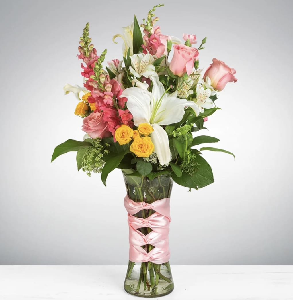Rapunzel by BloomNation™ - This arrangement includes asiatic lilies, roses, carnations, snapdragons, and other seasonal blooms. This is a great gift for a birthday, Mother's Day, or Just Because. APPROXIMATE DIMENSIONS: 13" D x 24" H