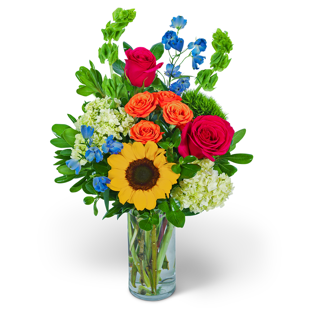Mixed bouquet with sunflowers, roses, and blue flowers in a glass vase