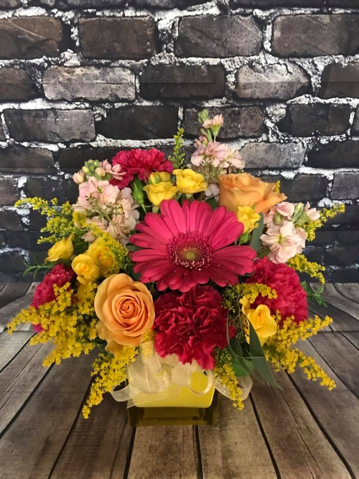 Colorful mixed flower bouquet with roses, gerbera daisies, and carnations