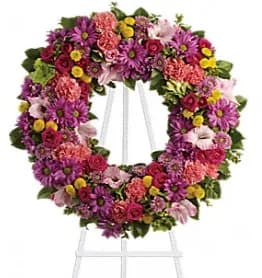 Ringed By Love - Memories of brighter days will offer solace and hope to the bereaved, as this vibrant multi-colored wreath expresses your caring and compassion during a time of mourning.
