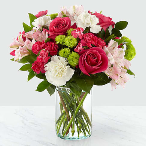 It's Sweet and Pretty  - The true beauty of this bouquet is within the sweet colors of the flowers. An array of hot pink roses, pale pink alstroemeria and more are set in a glass cylinder vase, making a wonderful gift to light up the face of its recipient