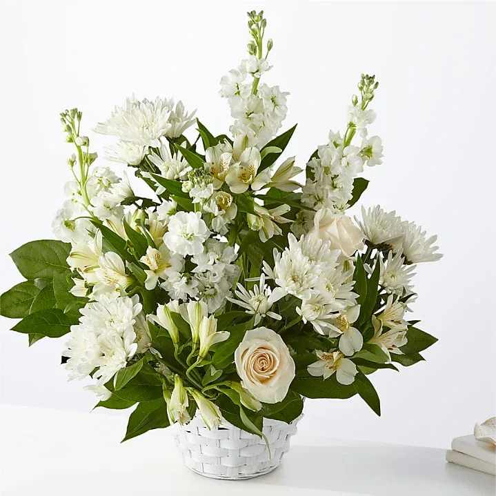 Eternal Affection - The classic display of all white flowers in a basket is a most traditional way to express sympathy. Good for the funeral home, church or an expression of sympathy to the families home. This arrangement will work.