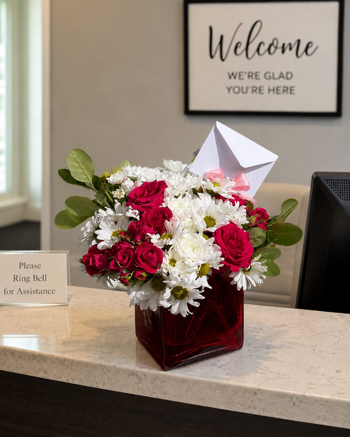 Beautiful Daisy You - This arrangement contains spray daisies and spray roses. This is a great birthday gift. APPROXIMATE DIMENSIONS: 9"L X 9"W x 9"H