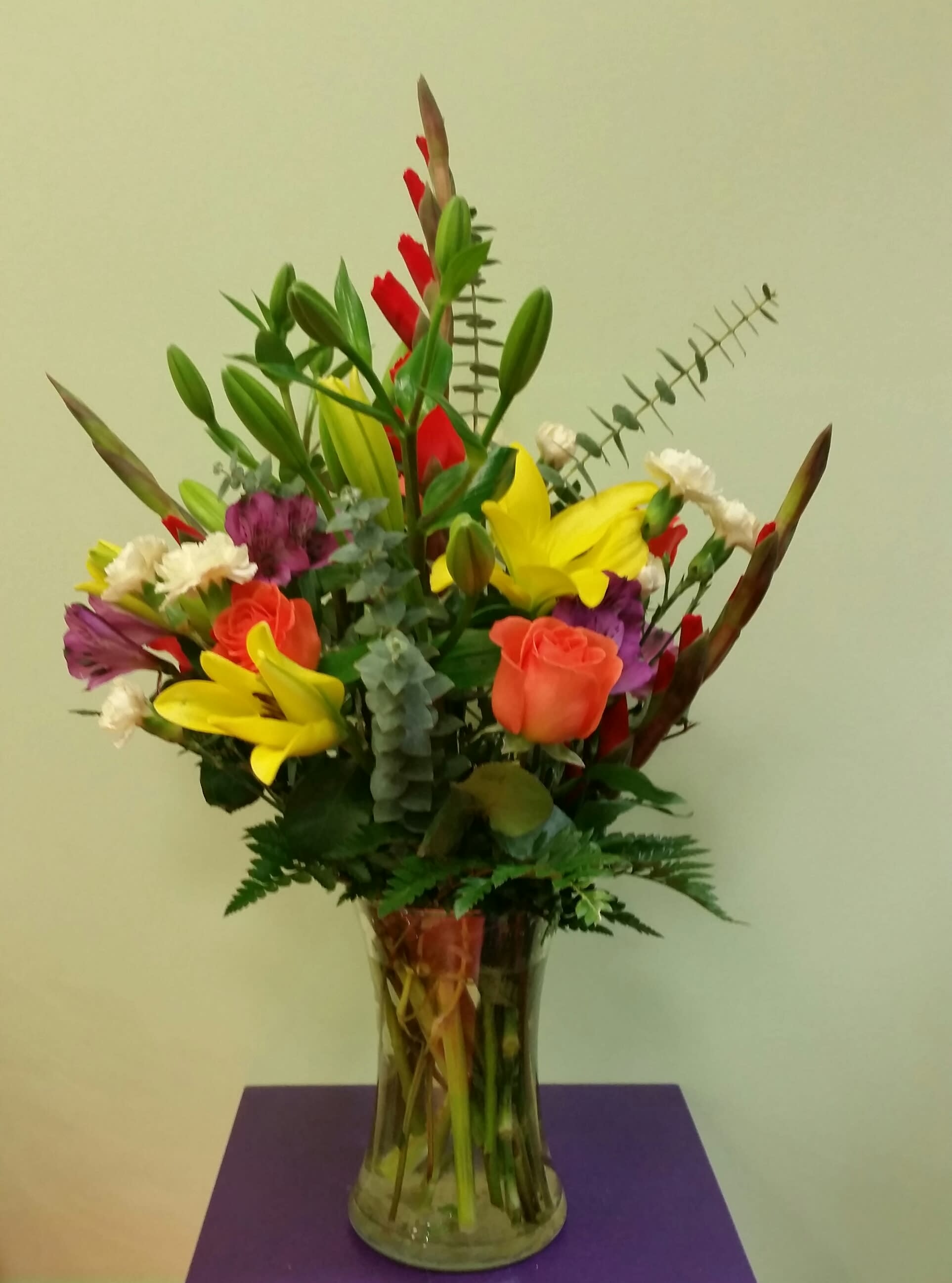 Colorful mixed bouquet in a clear glass vase