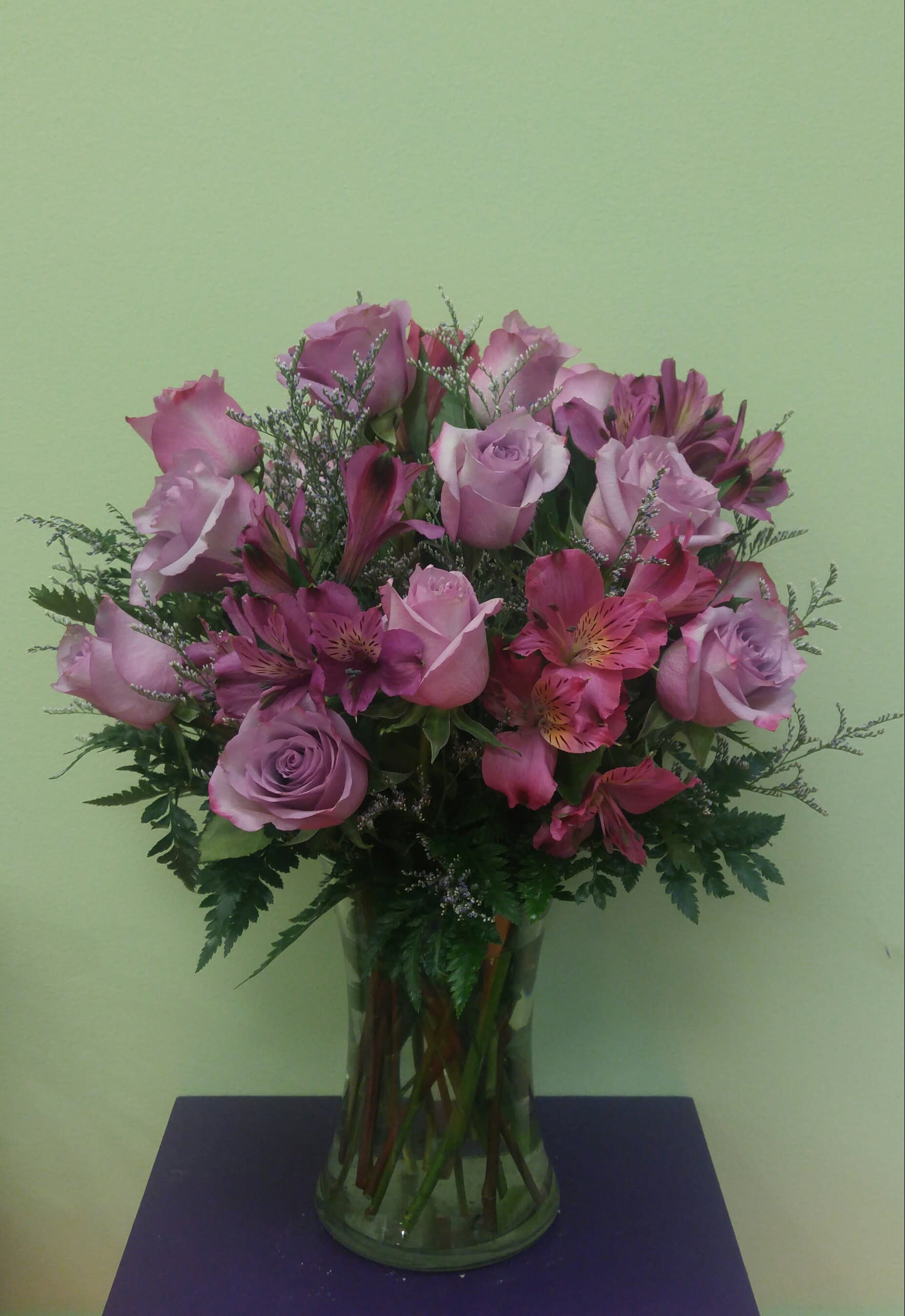 Pink roses and alstroemeria in a clear glass vase
