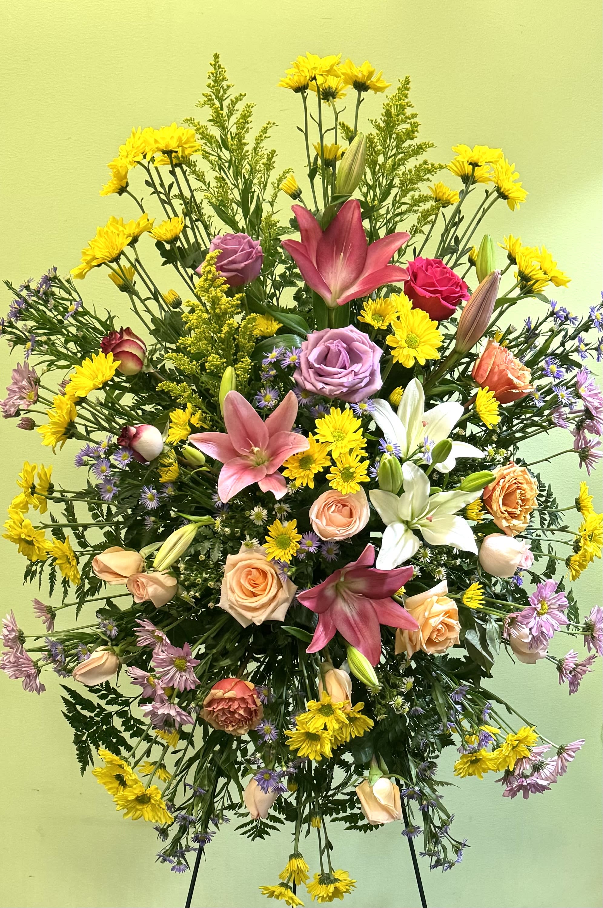 Large mixed bouquet with lilies, roses, and yellow daisies