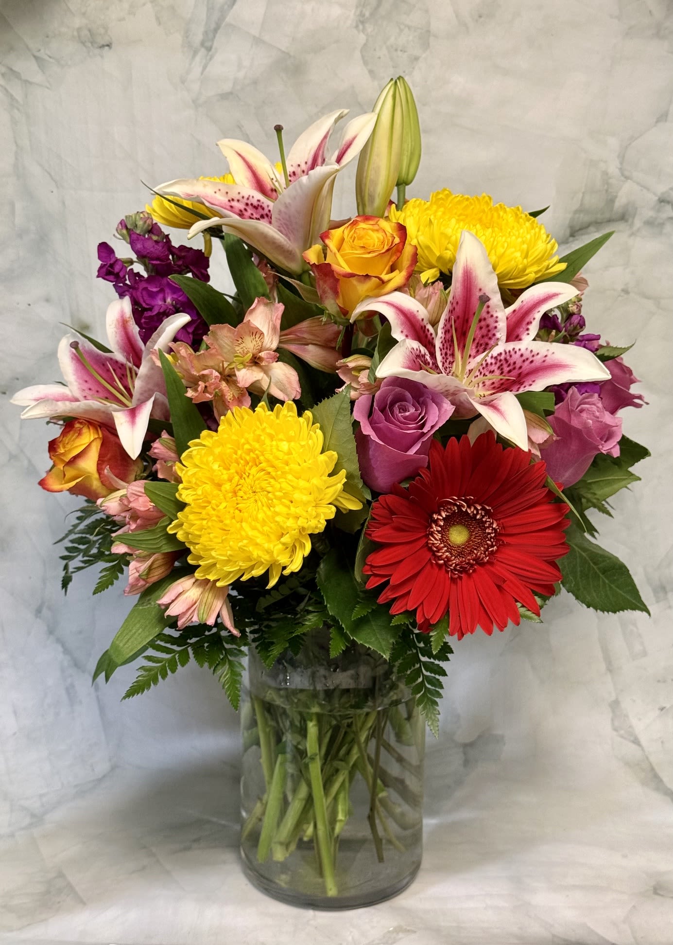 Summer Sophistication - This arrangement is truly stunning. It is full of color and beauty and is right for any occassion!