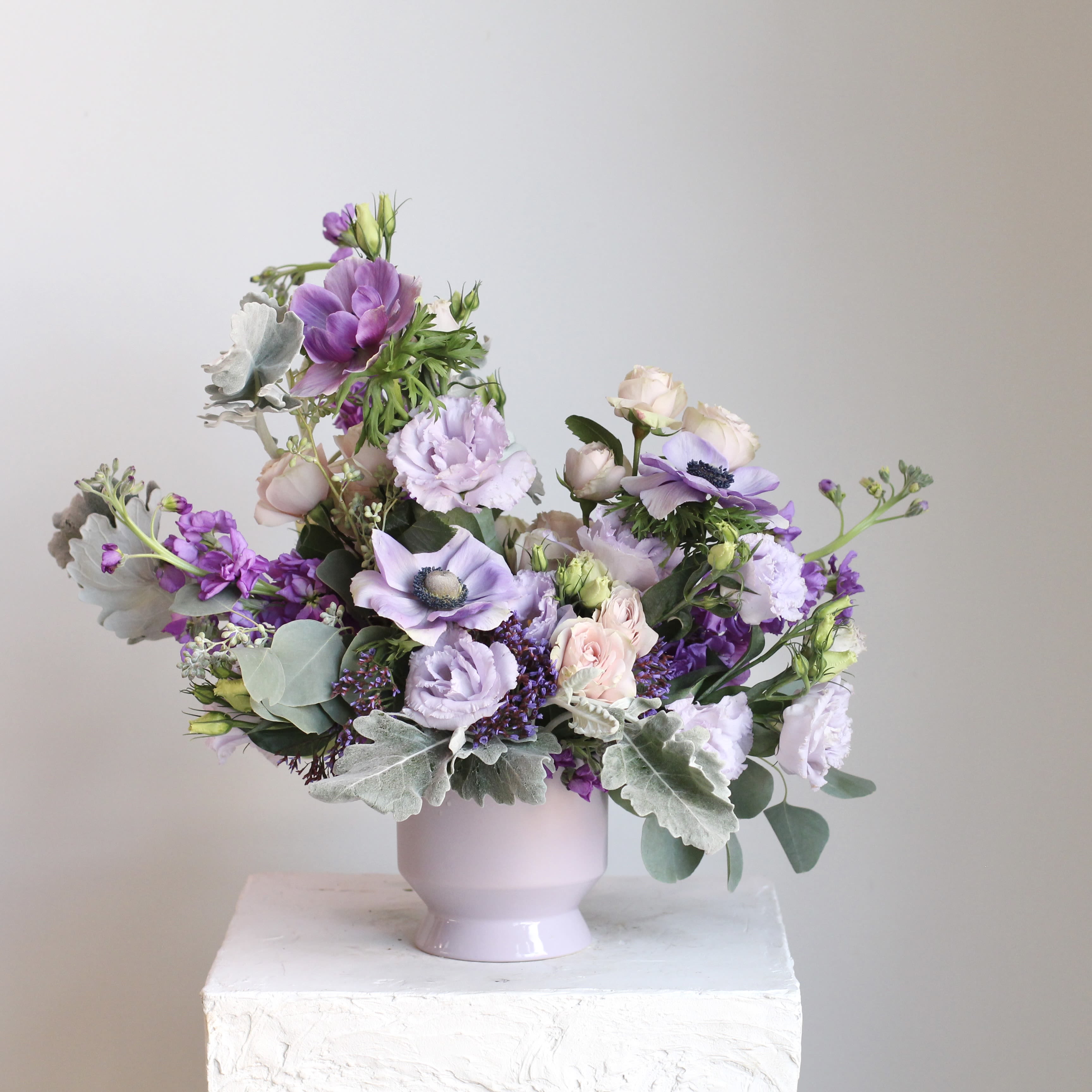 Amethyst - The Amethyst Arrangement features a balanced mix of soft lavender and deep purple tones, making it a versatile choice for both special occasions and everyday settings. Thoughtfully designed to bring color and style into any space, it works beautifully as a centerpiece or a simple, polished accent.  Delivery Policy: At Middlemist, we aim to make every delivery seamless and delightful. It is the sender’s responsibility to ensure the recipient is available to accept delivery between 3–5pm on the scheduled date and that the delivery address is accurate. We will send a text notification to the recipient on the day of delivery. If no one is available to receive the order, it will be returned to the shop and may be picked up or redelivered for an additional delivery fee. If a recipient requests the order be left unattended, we cannot guarantee the condition of the flowers or plants, and no refunds will be issued once an order is left outside.