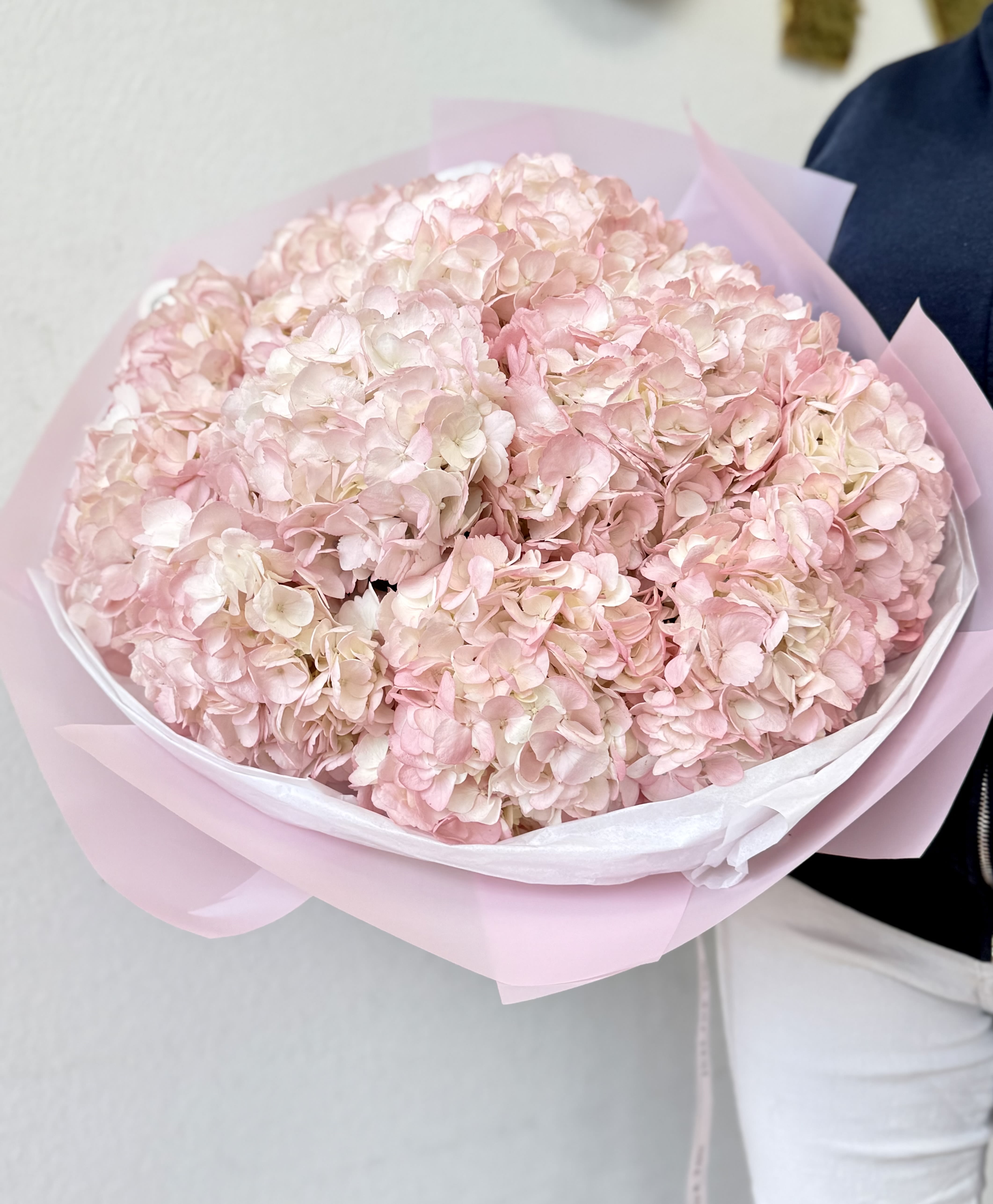 "Pink Cloud" Hydrangea Bouquet - Extra-large bouquet of 10 stems of pink sprayed hydrangea, wrapped in decorative paper. All bouquets come without a vase. You can choose a vase in the add-on section.  Note: Flower food, transportation bag, and flower care instructions are included
