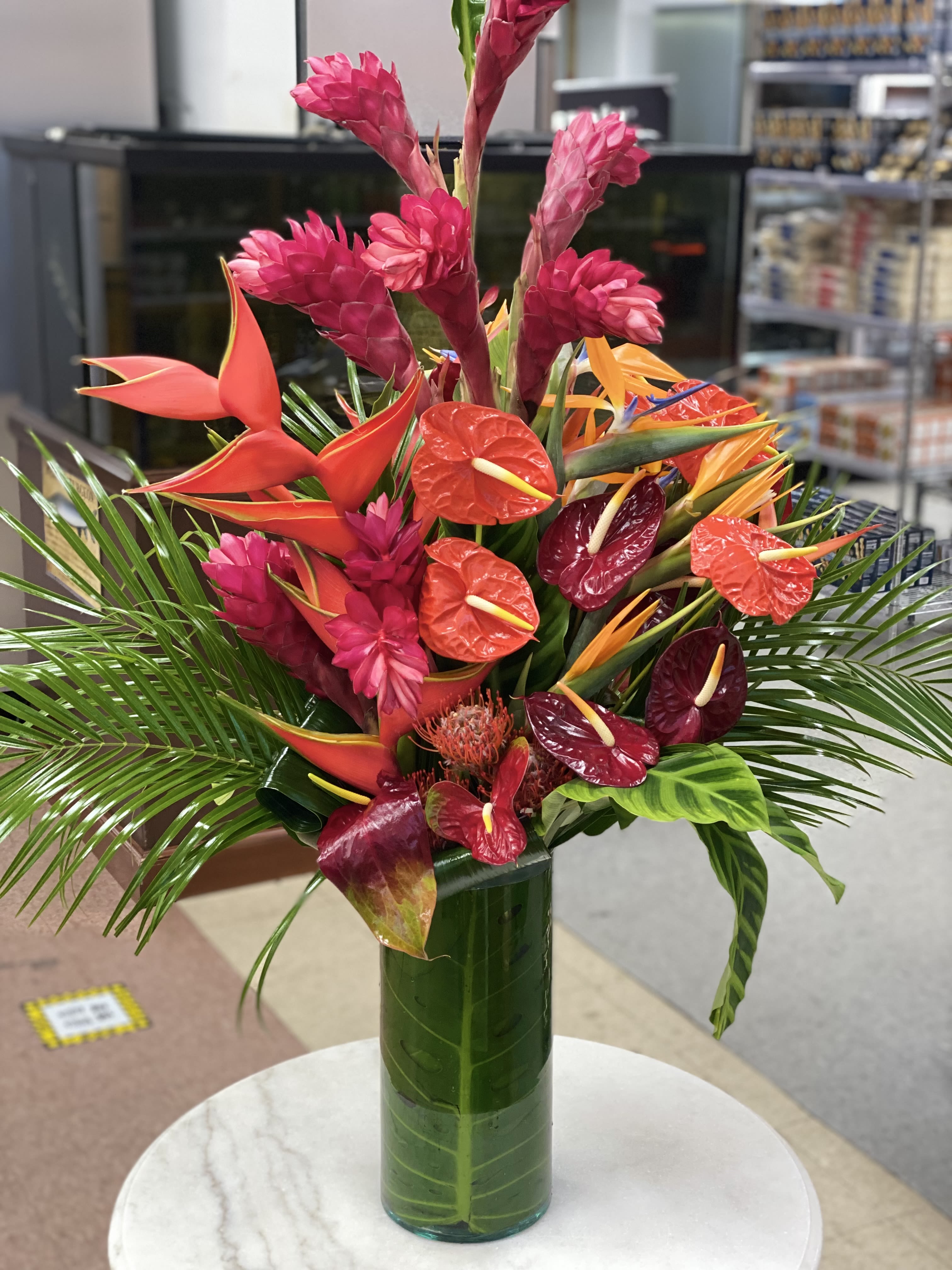 Tropical Eden  - Vase or box with selection of tropical flowers 