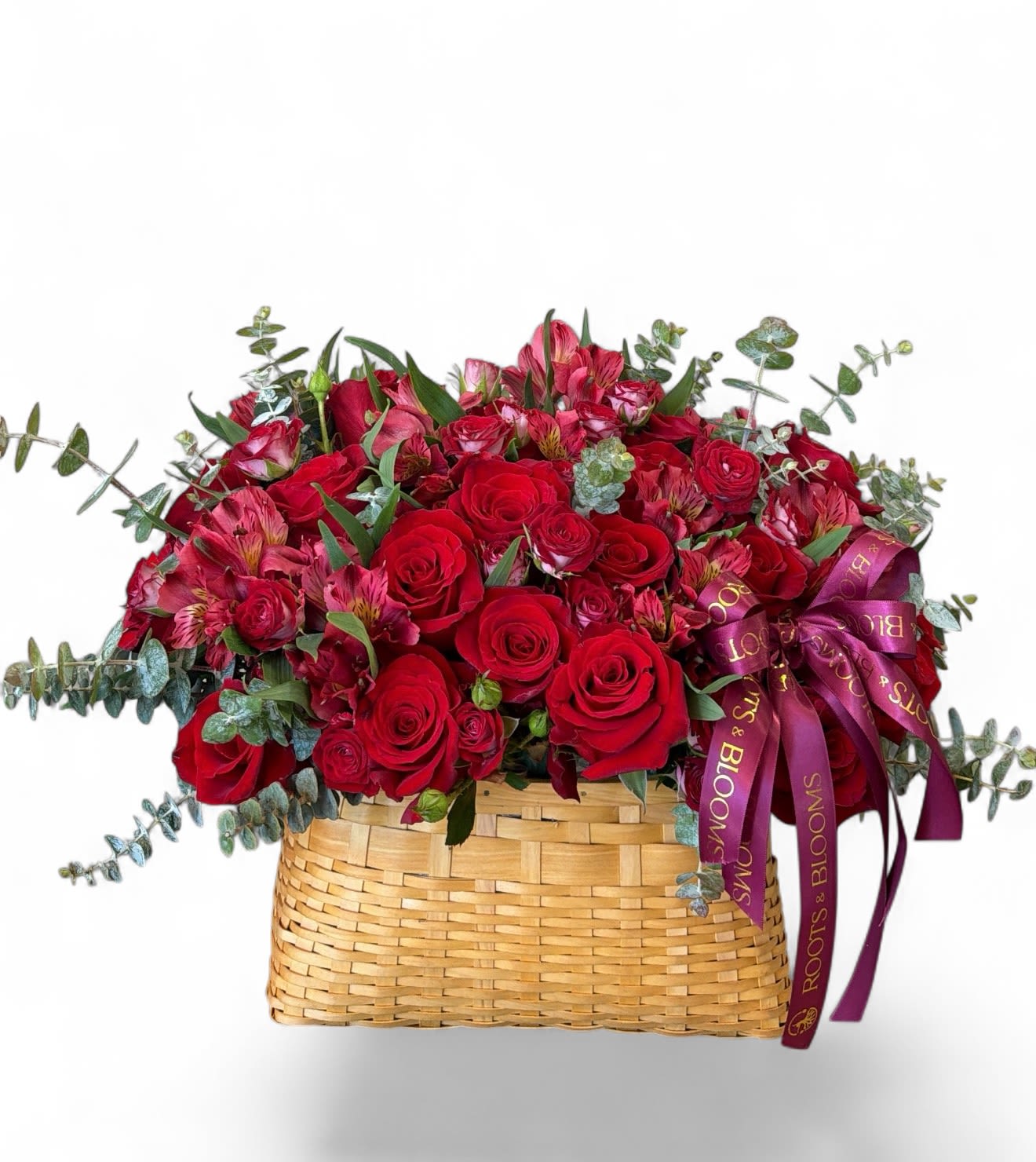 Crimson Garden Basket - A lush, garden-style arrangement of rich red roses and delicate accents, beautifully arranged in a woven basket with soft greenery. -romantic, full, and effortlessly elegant.