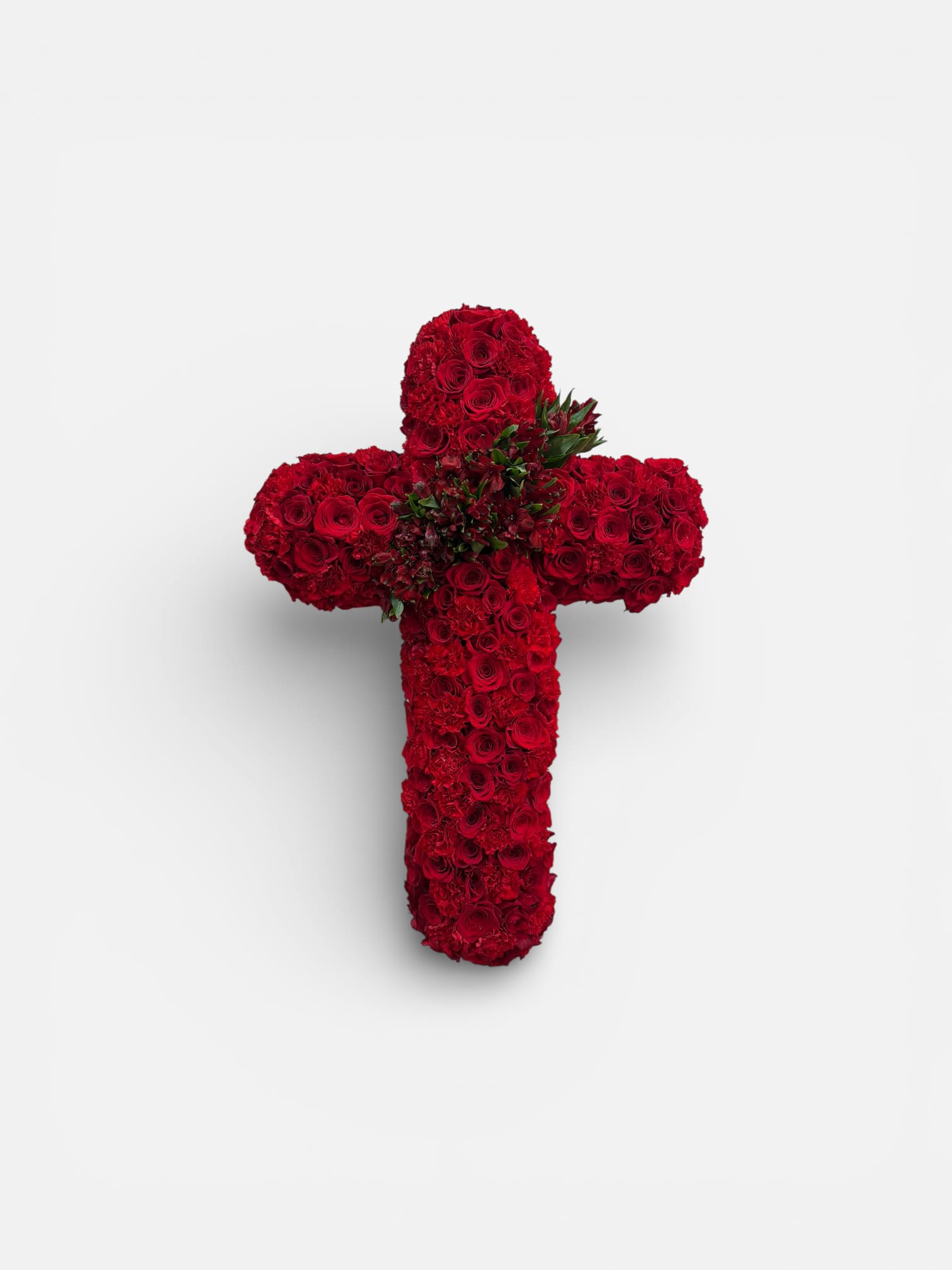 Red rose cross-shaped floral arrangement on a white background