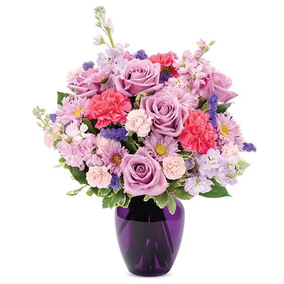Lavender and pink mixed bouquet in a purple vase
