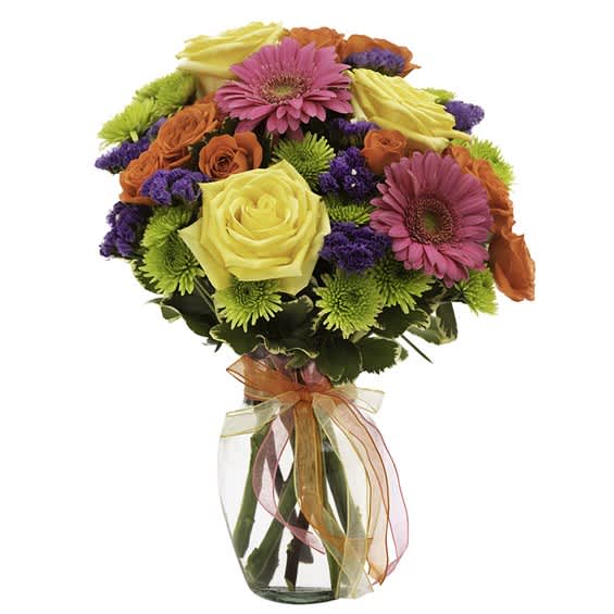 Bouquet of pink, yellow, orange, and purple flowers in a glass vase