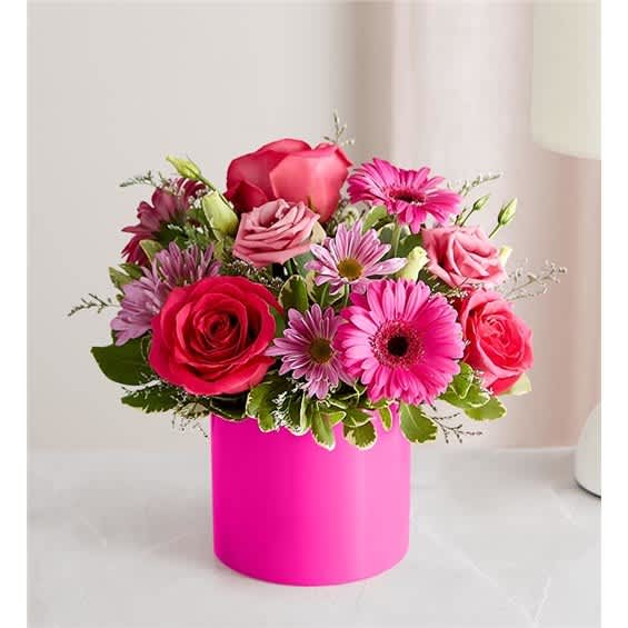 Pink and red mixed bouquet in a bright pink box vase