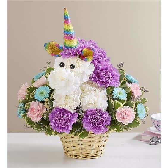 Unicorn-themed flower basket with a rainbow horn and pastel blooms