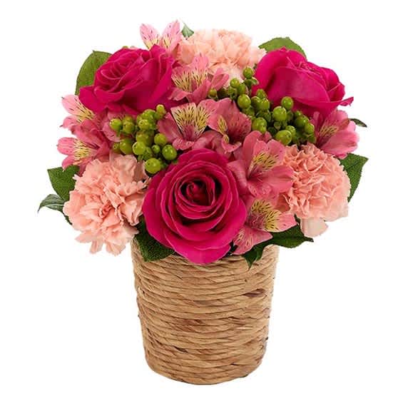 Pink rose and carnation arrangement in a rope-wrapped basket