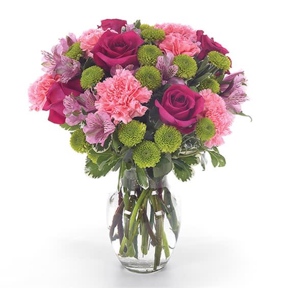 Pink and magenta bouquet in a clear glass vase