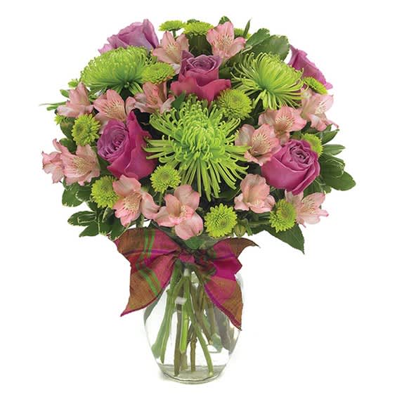 Bouquet of pink roses and green chrysanthemums in a glass vase